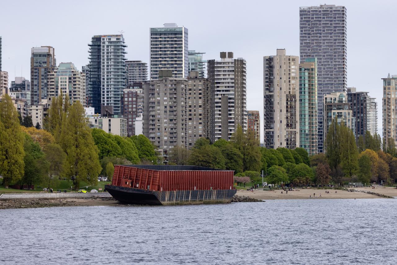 Unmoored Barged washed away on to Sunset Beach during the Wind Storm in Downtown British Columbia.
