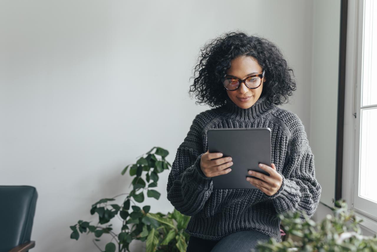 Woman reading from a tablet