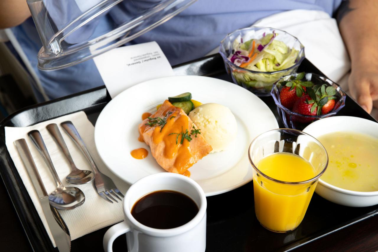 Photo of plant-rich menu items on a tray on a patient's lap.