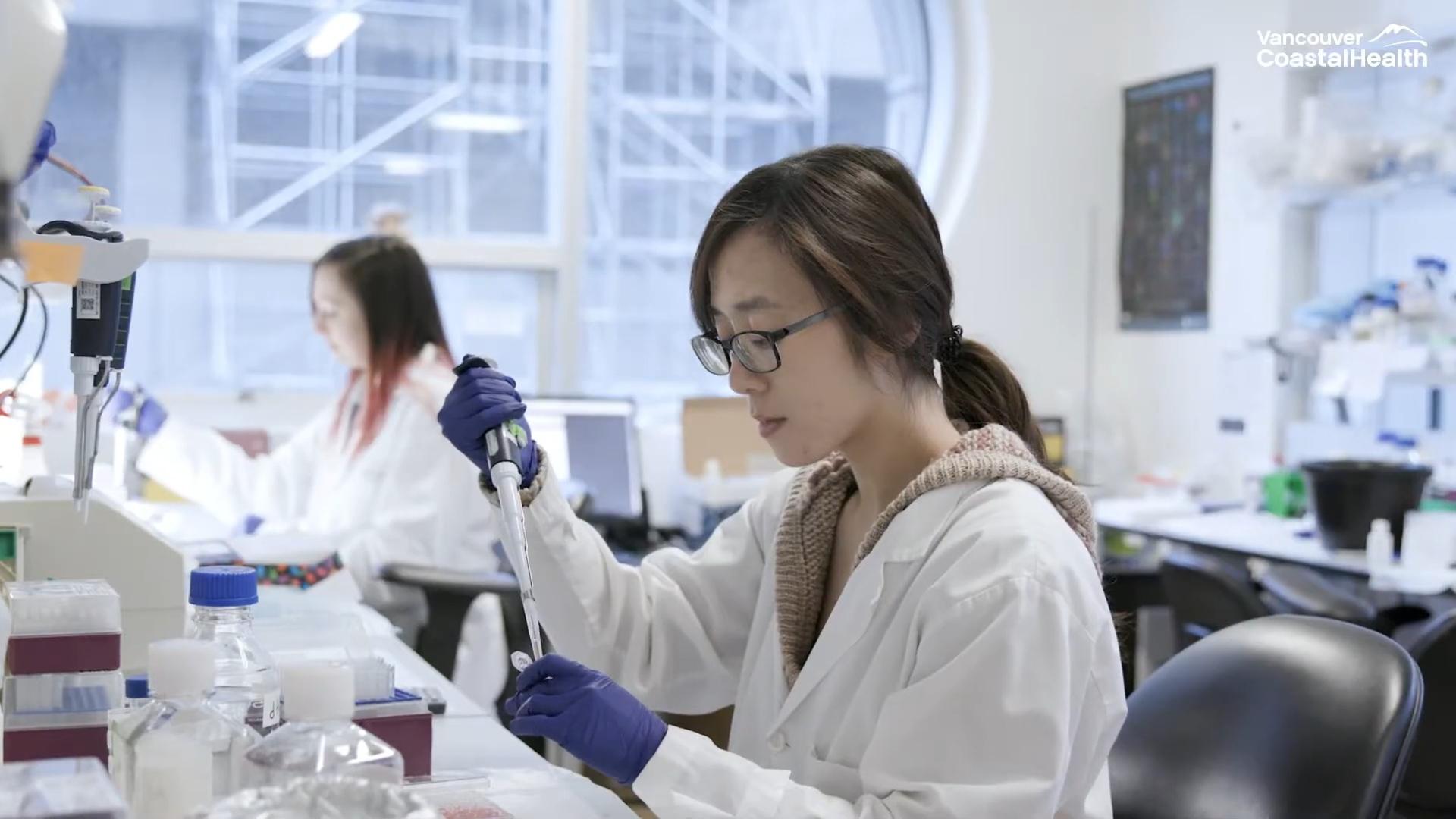 VCH employee using a pipette to create a sample