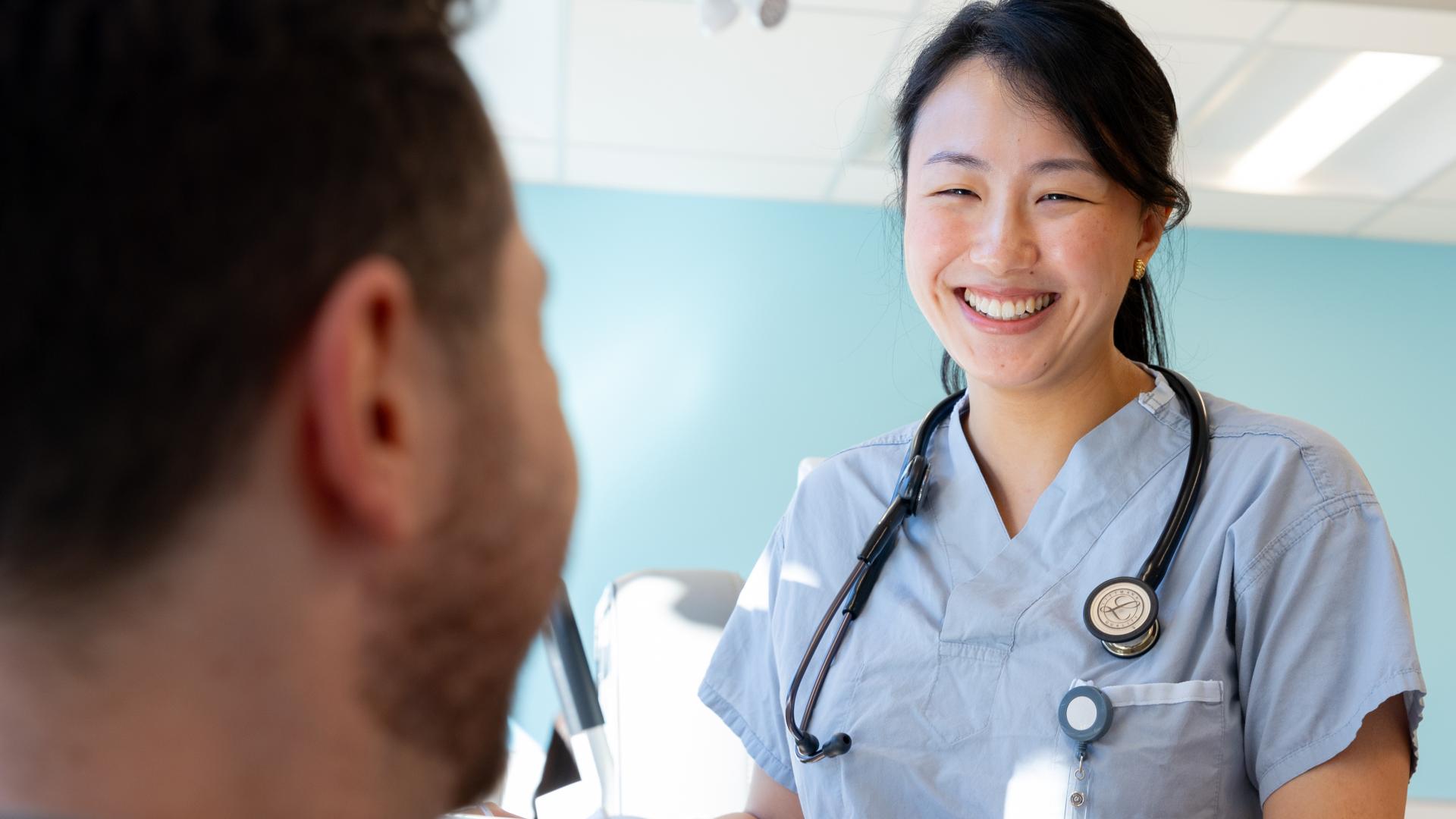 Physician talking with patient at a UPCC