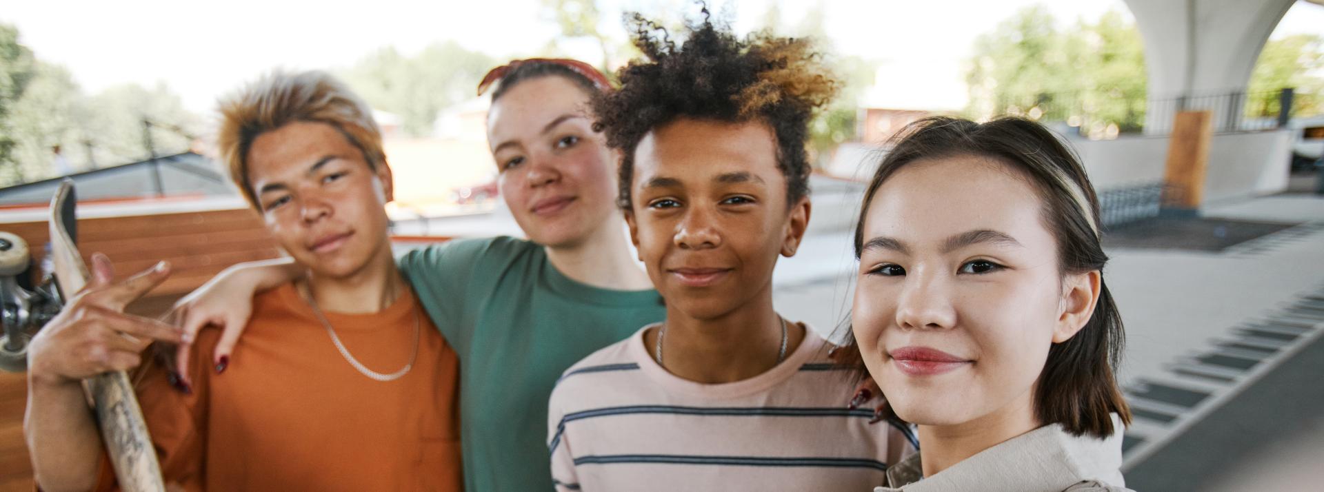 group of young teens taking a selfie
