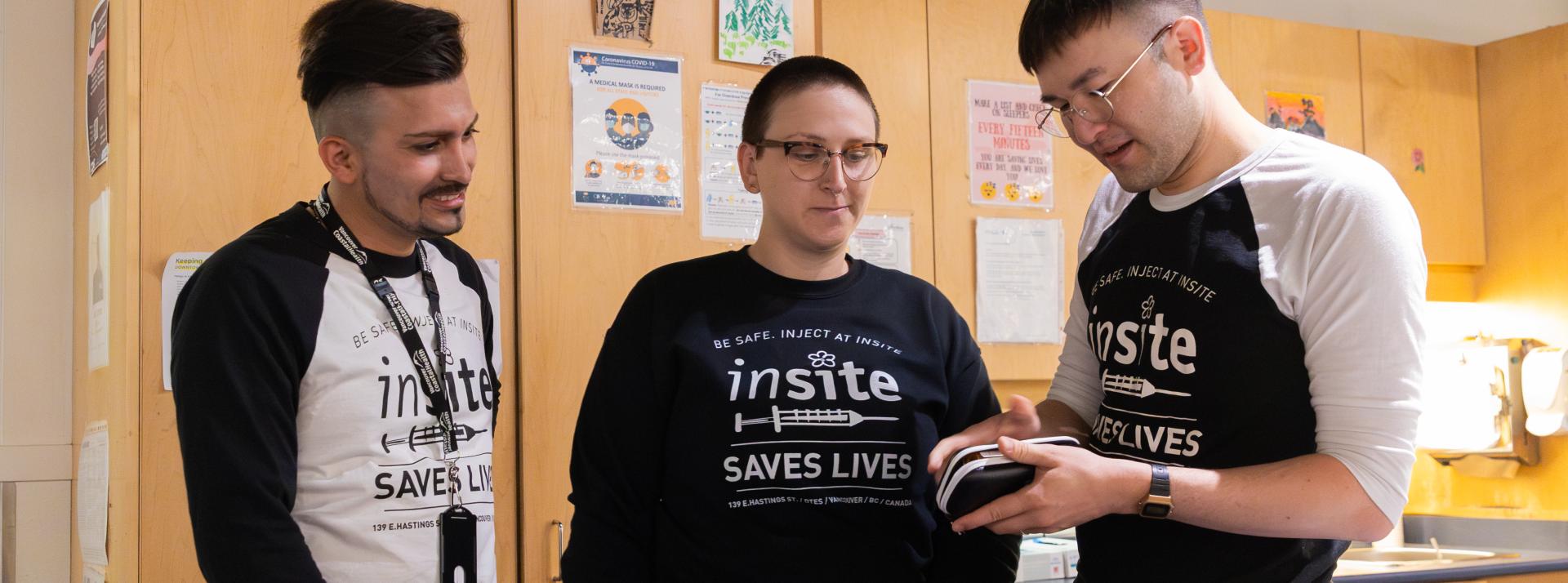 Team at Insite in Vancouver looks at naloxone kit.