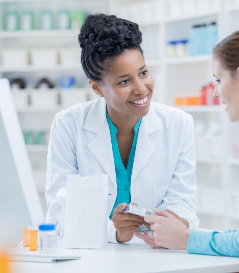 Pharmacy customer asksing a pharmacist a question