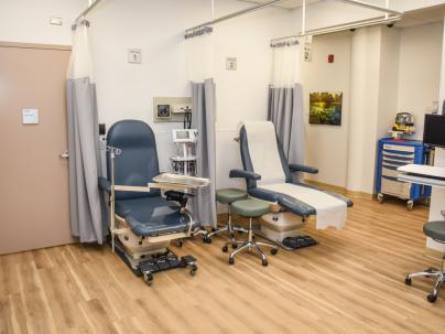 Examination room inside the Heatley Community Health Centre.  Two exam chairs are visible
