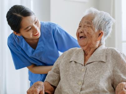 Nurse accompanying a senior person