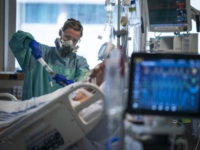Nurse taking care of patient inintensive care