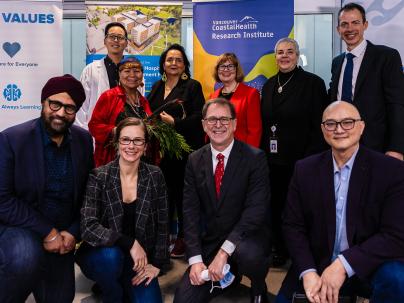 Project members pose during announcement of Cancer Care Clinic completion